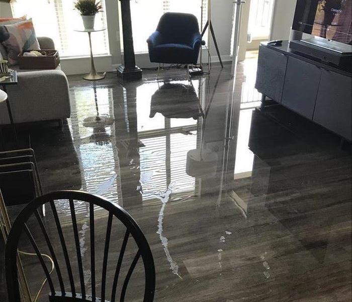 Water sitting on top of apartment floor
